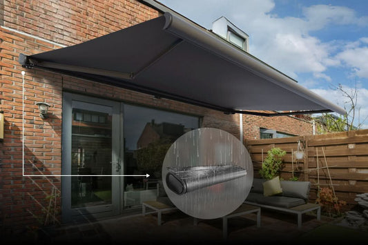 Retractable outdoor awning providing weather-resistant shade and rain protection for a backyard patio.