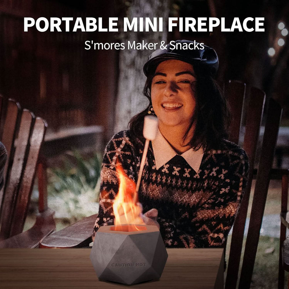 Portable mini tabletop fireplace used for roasting marshmallows and making s’mores outdoors