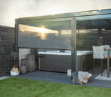 Modern pergola with retractable side screen creating a private outdoor spa and relaxation area