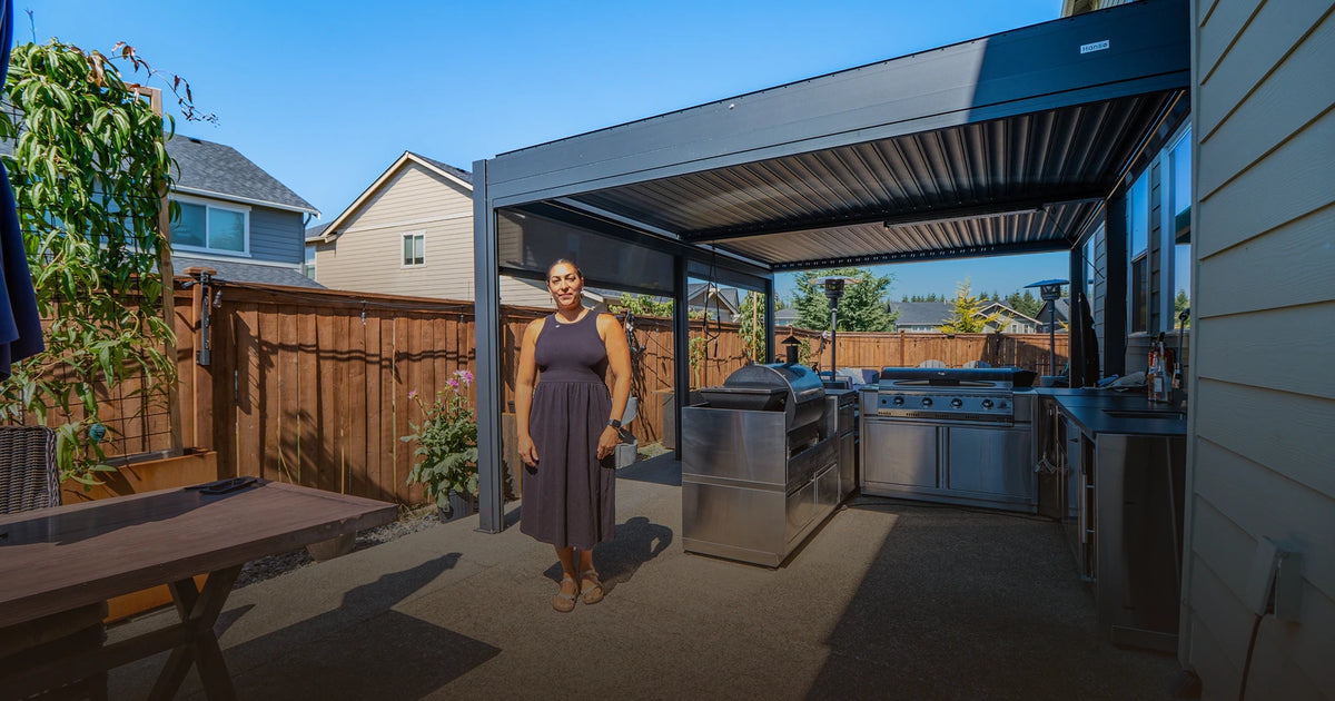 Creator standing with a Hansø pergola in a real backyard